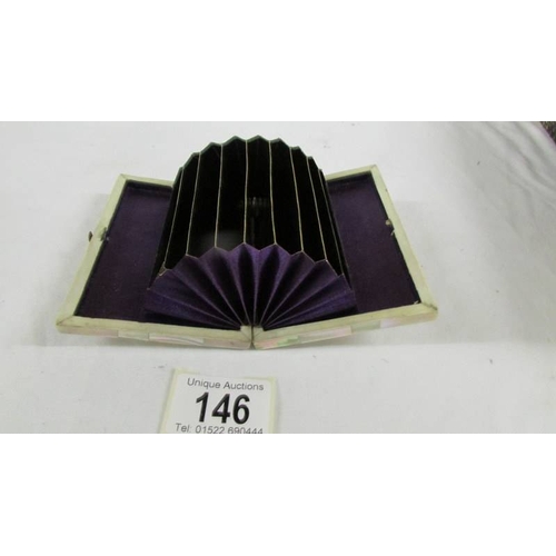 146 - A wallet type mother of pearl card case.