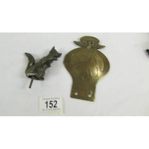 152 - A bronzed fox car mascot and a 1930's S African AA badge.