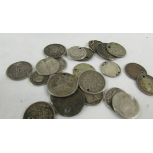 158 - 24 silver coins with holes in, 38 grams.