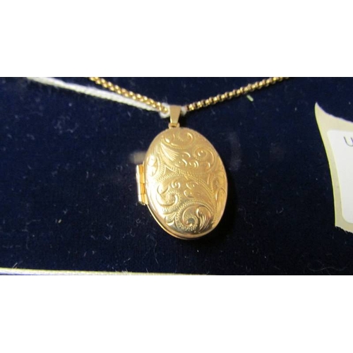 168 - A 9ct gold locket and chain.  8.8 grams.