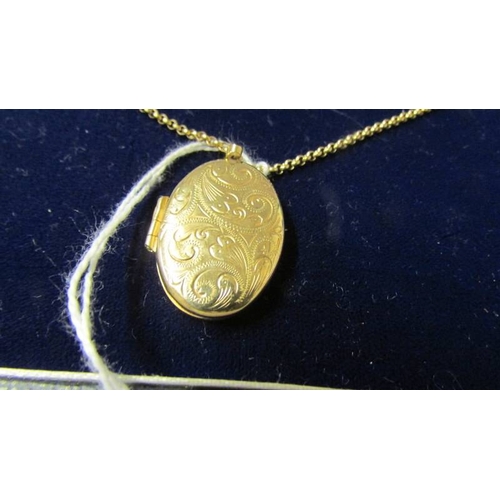 168 - A 9ct gold locket and chain.  8.8 grams.