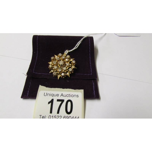 170 - An 18ct gold and diamond pendant/brooch.