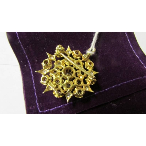 170 - An 18ct gold and diamond pendant/brooch.