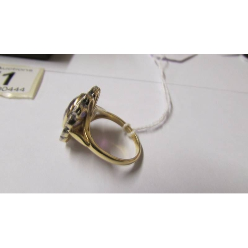 171 - An 18ct gold diamond and amethyst ring, size N.