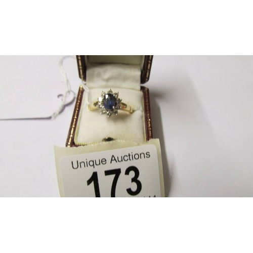 173 - An 18ct gold sapphire and diamond ring, M half.