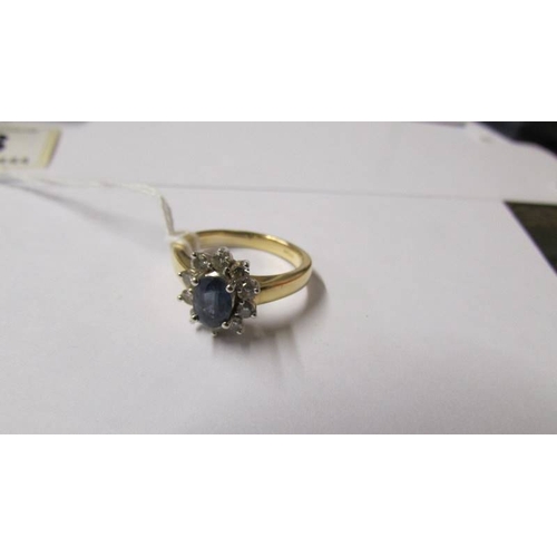 173 - An 18ct gold sapphire and diamond ring, M half.