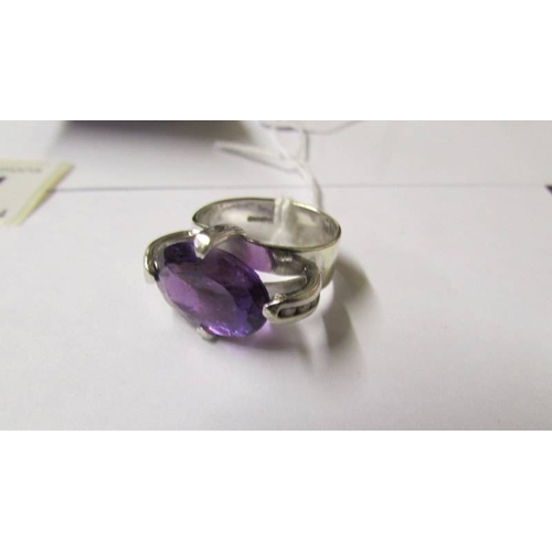 174 - A 9ct gold white gold amethyst and diamond ring, size R.