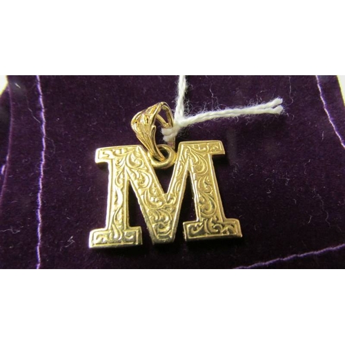 176 - A 9ct gold letter M pendant, 7 grams.