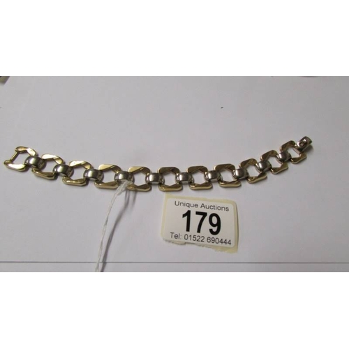 179 - A 9ct white and yellow gold bracelet, 20 grams.
