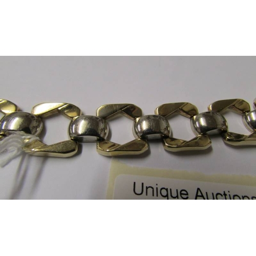 179 - A 9ct white and yellow gold bracelet, 20 grams.