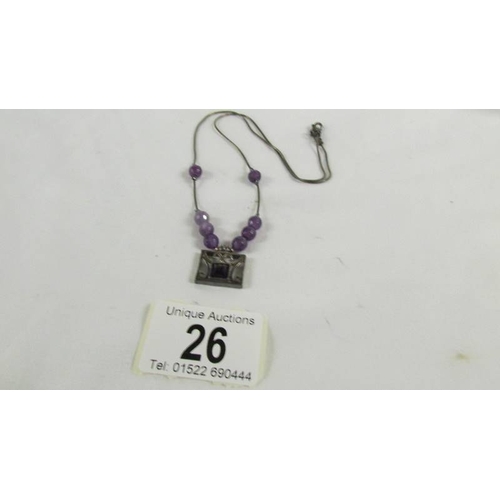 26 - A silver pendant necklace.