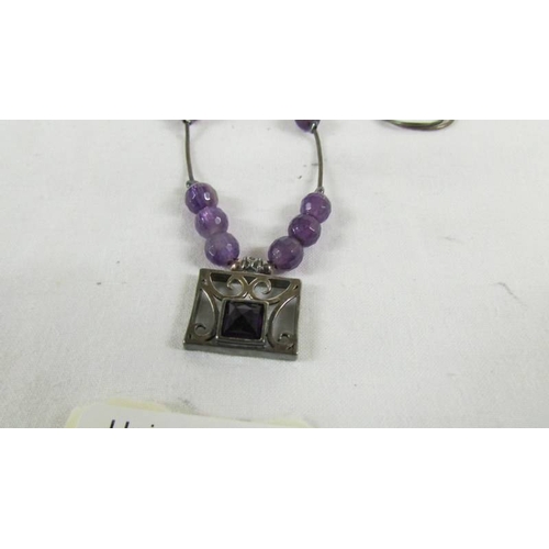 26 - A silver pendant necklace.
