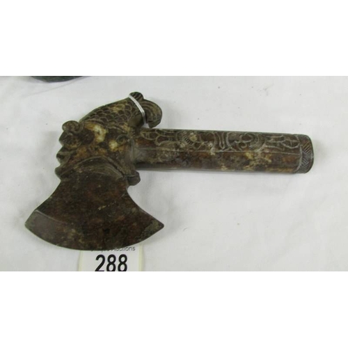 288 - A Chinese archaistic Shang Dynasty-style mottled brown and caramel jade ceremonial axe with mythical... 