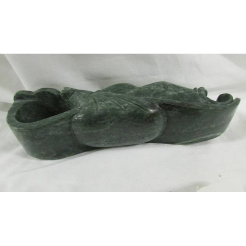 288 - A Chinese archaistic Shang Dynasty-style mottled brown and caramel jade ceremonial axe with mythical... 