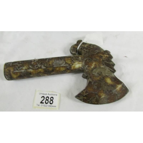 288 - A Chinese archaistic Shang Dynasty-style mottled brown and caramel jade ceremonial axe with mythical... 