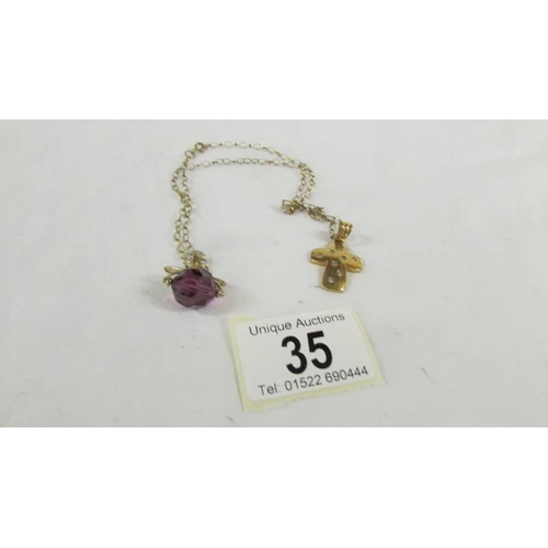 35 - A 9ct gold fob and a 9ct gold cross on a 9ct gold chain,  5.5 grams without fob.