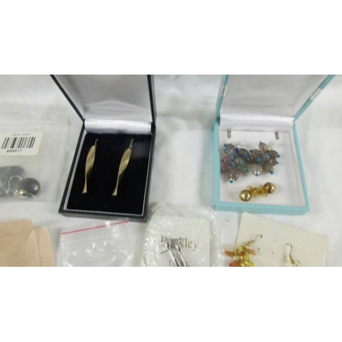 38 - In excess of 15 pairs of earrings.