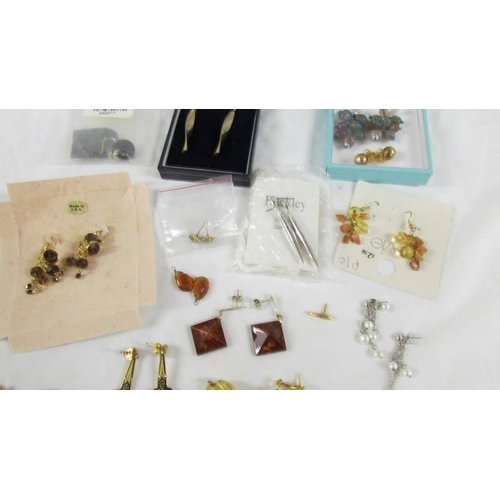 38 - In excess of 15 pairs of earrings.