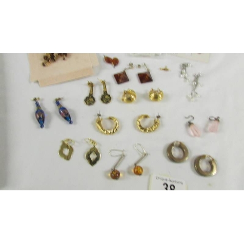 38 - In excess of 15 pairs of earrings.