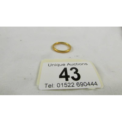 43 - A 22ct gold wedding ring, size L, 3.5 grams.
