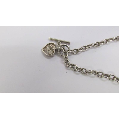 55 - A quality smoky quartz heavy silver pendant and chain with attached heart charm.  Total weight 80 gr... 