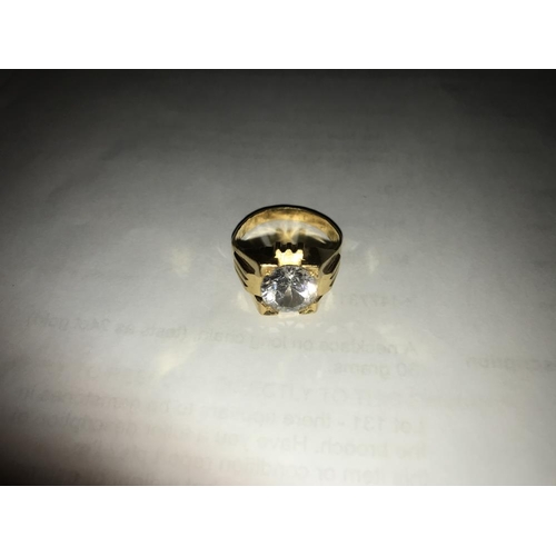 132 - A  ring set white stone (tests as 24 ct gold) size S.