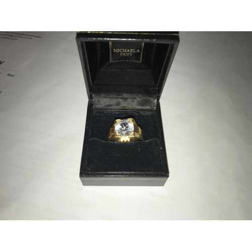 132 - A  ring set white stone (tests as 24 ct gold) size S.