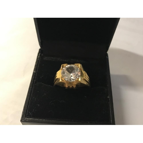 132 - A  ring set white stone (tests as 24 ct gold) size S.