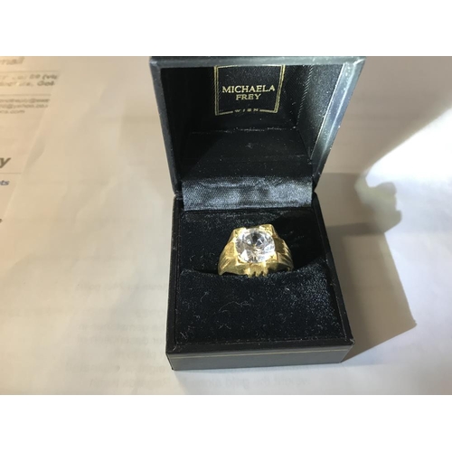 132 - A  ring set white stone (tests as 24 ct gold) size S.