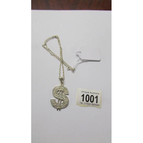 1001 - A silver white stone necklace designed as a dollar sign, length approximately 50 cm.