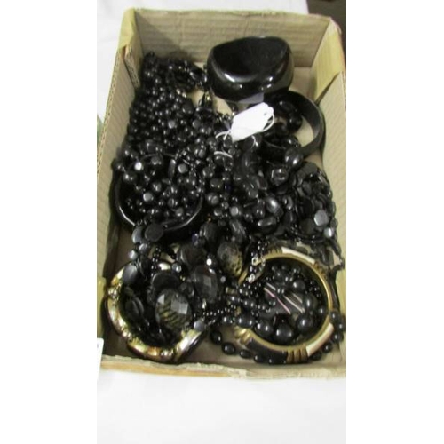 1010 - A mixed lot of black bead jewellery.