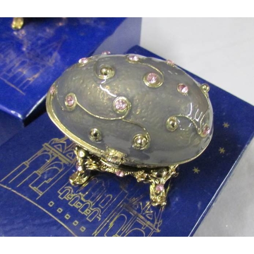 1016 - 9 boxed Atlas Editions Faberge style eggs with certificates.