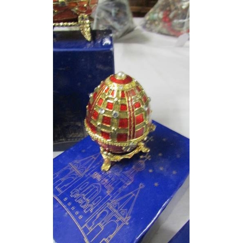 1016 - 9 boxed Atlas Editions Faberge style eggs with certificates.