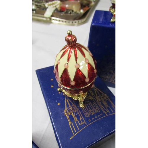 1016 - 9 boxed Atlas Editions Faberge style eggs with certificates.