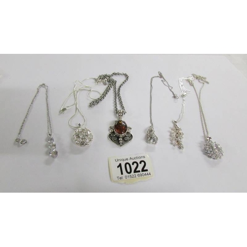 1022 - 6 assorted silver pendants.