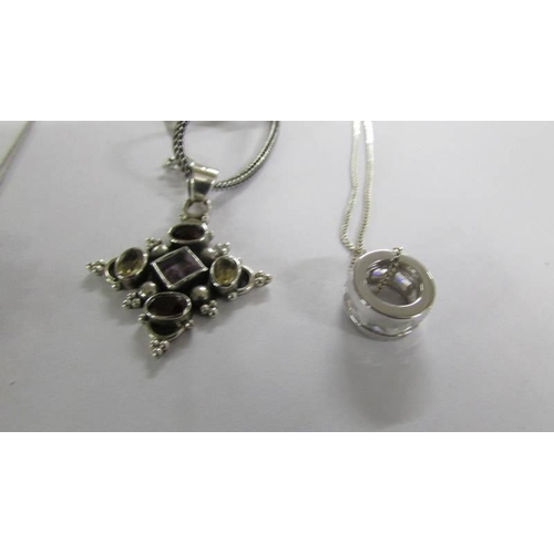 1023 - 6 assorted silver pendants.