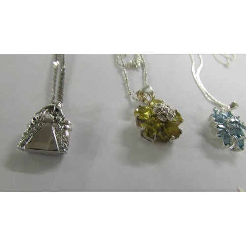 1023 - 6 assorted silver pendants.