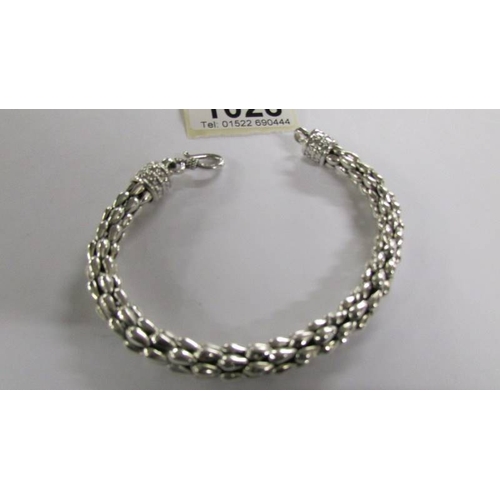 1028 - Three silver bracelets.