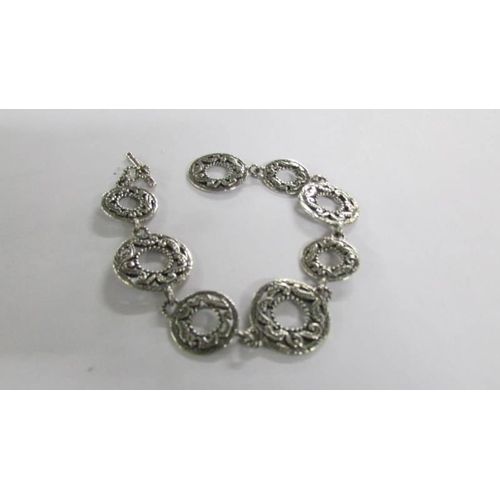 1028 - Three silver bracelets.