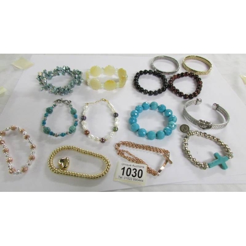 1030 - 14 assorted bracelets.