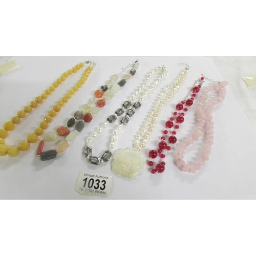 1033 - 6 assorted stone necklaces in various colours.