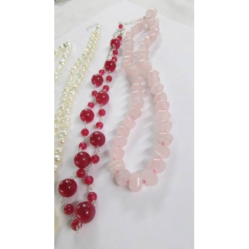 1033 - 6 assorted stone necklaces in various colours.