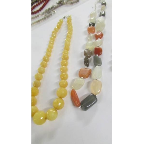 1033 - 6 assorted stone necklaces in various colours.