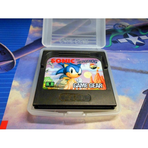 176 - A Sega Game Gear with approx 9 games (condition unknown, sold as seen)