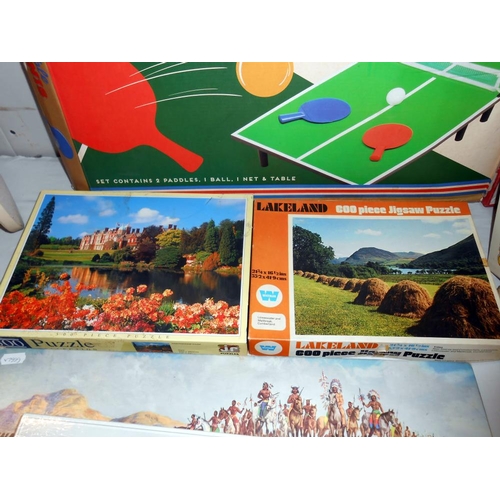 177 - A quantity of games and jigsaws including The Battle of Little Big Horn and table tennis