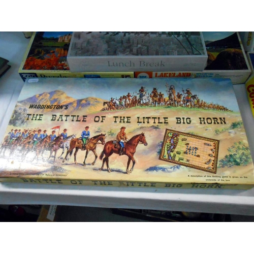 177 - A quantity of games and jigsaws including The Battle of Little Big Horn and table tennis