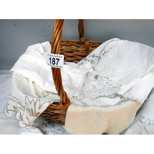 187 - A quantity of mixed linen and a wicker basket