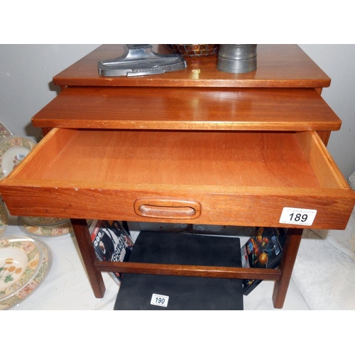 189 - A teak 2 piece nest of tables, small table has a drawer