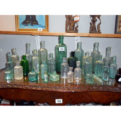 192 - A quantity of antique glass bottles