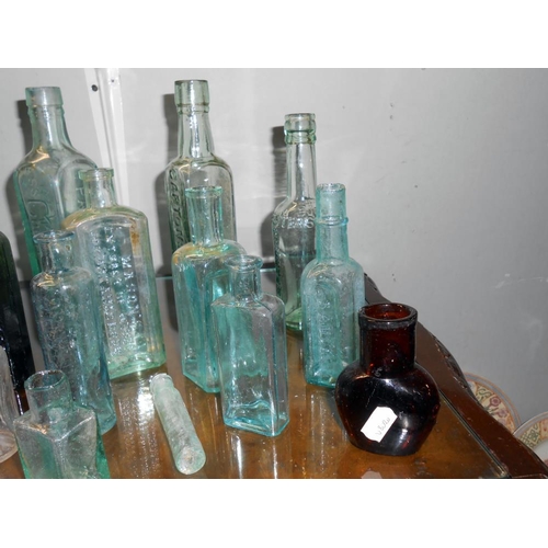 192 - A quantity of antique glass bottles